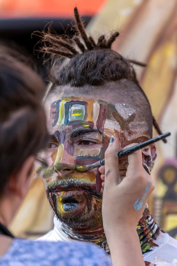 Face and body painting of a man