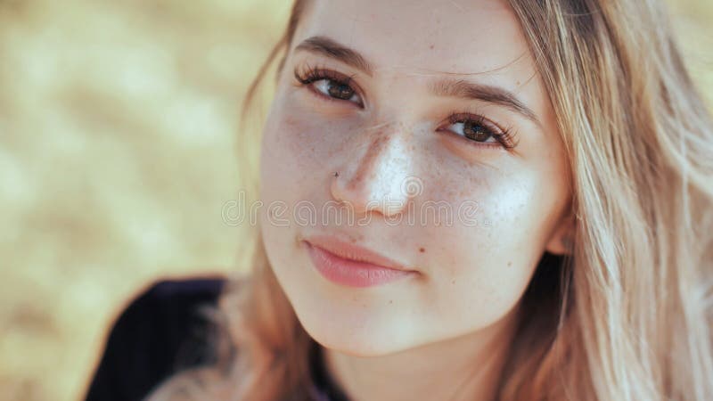 Face close-up of a nice young blonde russian girl.