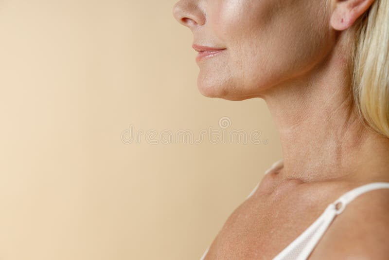 Face Closeup Of Mature Blonde Woman In White Underwear Smiling Away