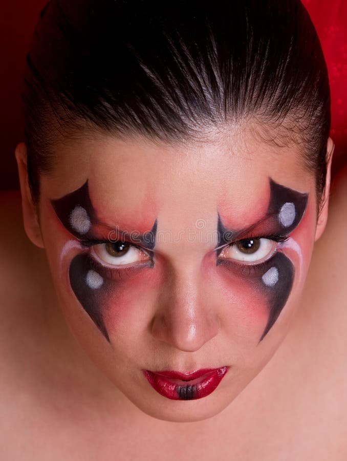 Face de uma mulher com pintura de corpo como a aranha. fotografia de stock Face de uma mulher com pintura de corpo como a aranha. fotografia de stock