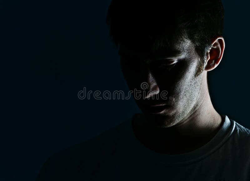 Dramatic Side Lit Face of a Young Man. Dramatic Side Lit Face of a Young Man