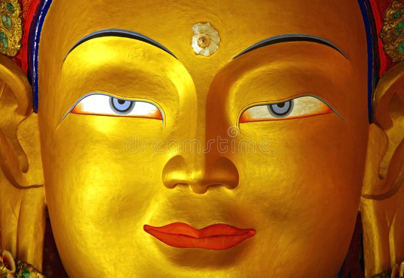 Face dourada de buddha