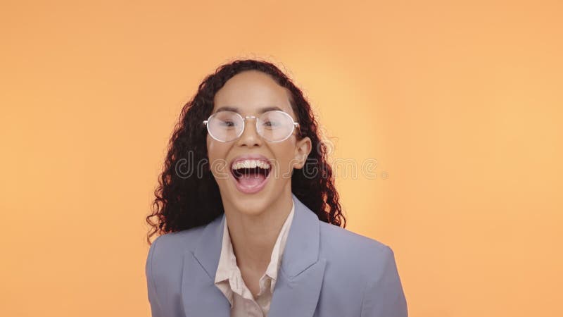 Face, entrepreneur and woman with celebration, fist and consultant against a studio background. Portrait, female leader stock video