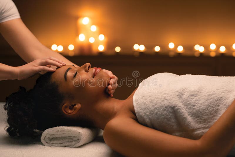 Panoramic Photo Of Smiling Black Woman Laying On Massage Table Stock
