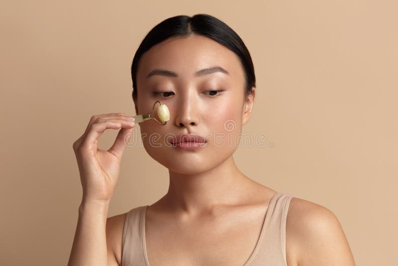 Face Massage Asian Woman Taking Care Of Skin With Natural Massager Portrait Stock Image Image