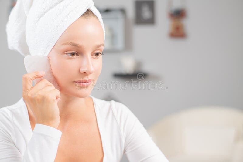 Face Massage Beautiful Woman Is Getting Massage Face Using Jade Stone For Skin Care Stock Image