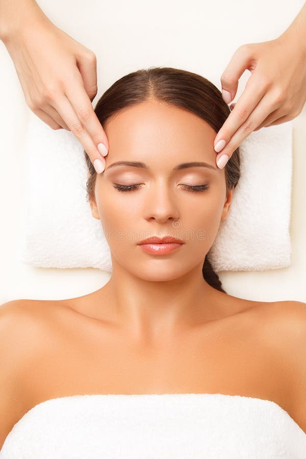 Face Massage Close Up Of A Young Woman Getting Spa Treatment Stock