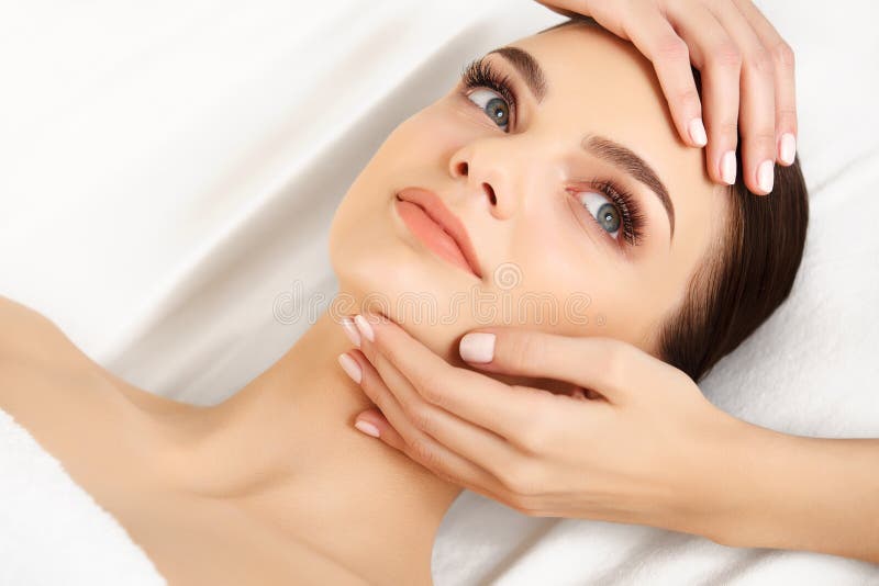 Face Massage Close Up Of A Young Woman Getting Spa Treatment Stock