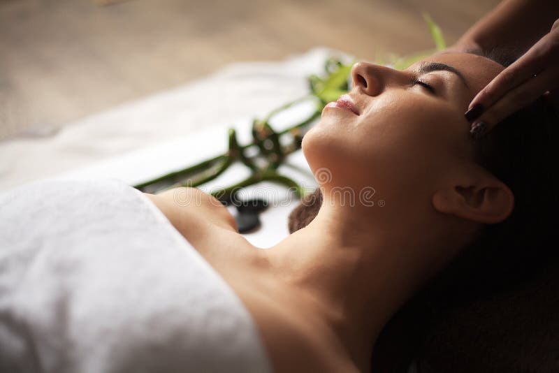 Face Massage Close Up Of A Young Woman Getting Spa Treatment Stock