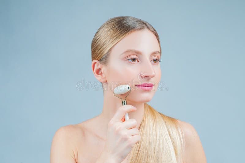 Face Massage Beautiful Woman Getting Massage Face Using Roller Massage Stock Image Image Of