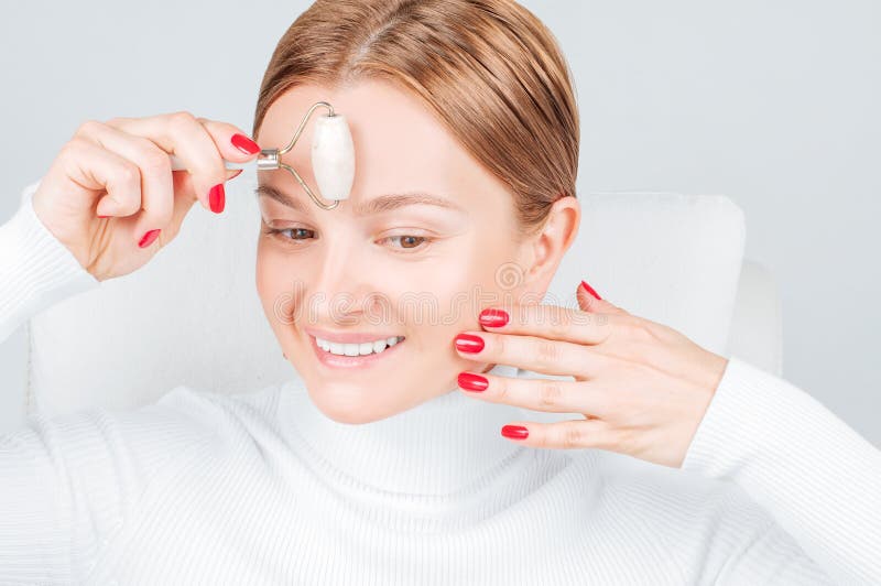 Face Massage Beautiful Woman Getting Massage Forehead Using Roller