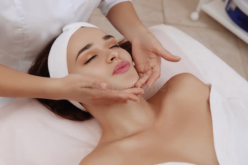 Face Massage of a Young Woman Getting Spa Treatment. stock image Face Massage of a Young Woman Getting Spa Treatment. stock image