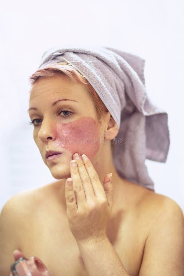 Face peeling mask, beauty treatment, skincare. Woman getting facial care royalty free stock images Face peeling mask, beauty treatment, skincare. Woman getting facial care royalty free stock images