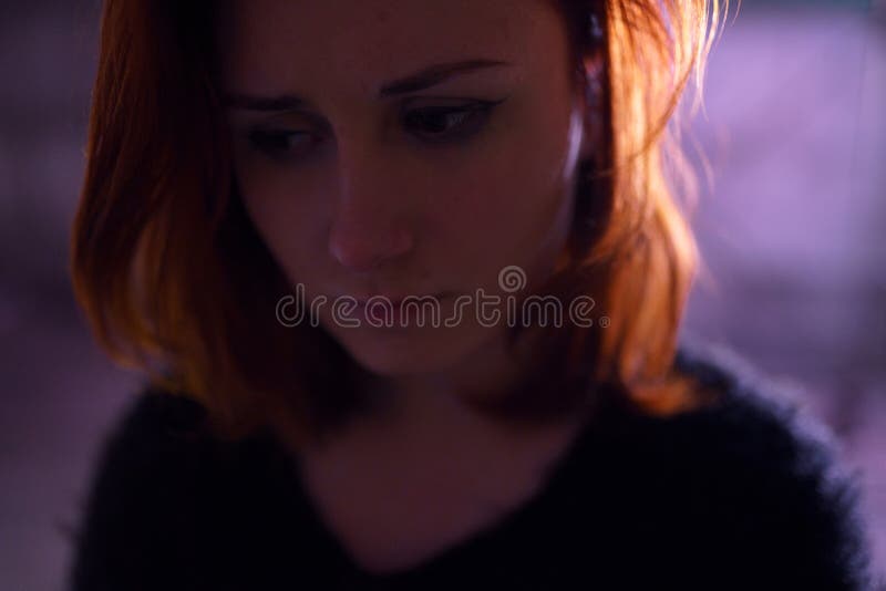 Face portrait close up of drug addiction redhead caucasian white young woman wearing black sweater, skirt and chocker royalty free stock photography Face portrait close up of drug addiction redhead caucasian white young woman wearing black sweater, skirt and chocker royalty free stock photography