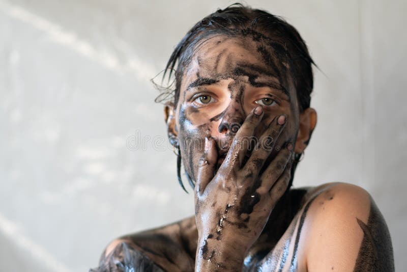 The face of a young beautiful girl is painted black royalty free stock photos The face of a young beautiful girl is painted black royalty free stock photos