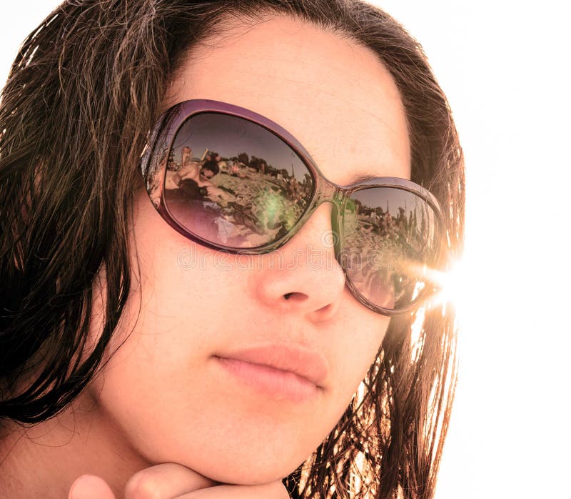 Face of Young Girl in Sunglasses with Beach Reflection Stock