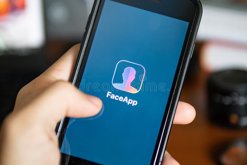 Bangkok, Thailand - July 18, 2019 : iPhone 7 showing its screen with FaceApp - AI Face Editor application. Digital editorial stock images, royalty-free photos and pictures