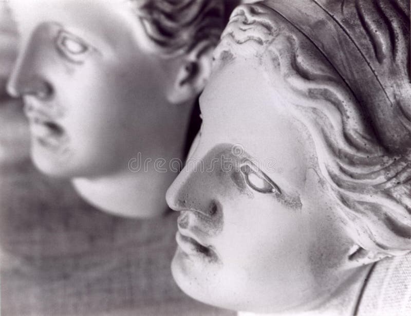 The faces of 2 female statues