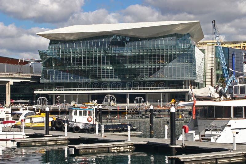 Faceted, sloped, tilted, fragmented, inclined, triangulated, triangular, angled, angular, and folded glass facade of ICC Sydney royalty free stock images Faceted, sloped, tilted, fragmented, inclined, triangulated, triangular, angled, angular, and folded glass facade of ICC Sydney royalty free stock images