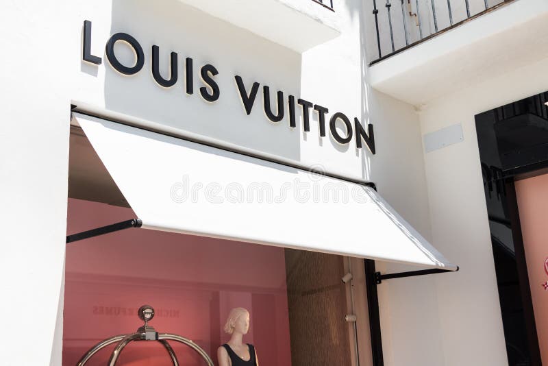 La tienda de ropa de diseñador de Louis Vuitton tiendas logotipos