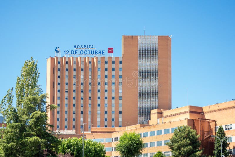 Madrid, Spain; 08/15/2020: Main facade of the `12 de Octubre` hospital, one of the hospitals that supports strong pressure due to those admitted by covid-19. Madrid, Spain; 08/15/2020: Main facade of the `12 de Octubre` hospital, one of the hospitals that supports strong pressure due to those admitted by covid-19