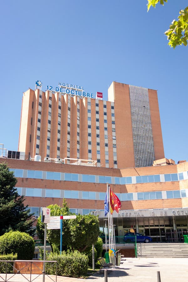 Madrid, Spain; 08/15/2020: Main facade of the `12 de Octubre` hospital, one of the hospitals that supports strong pressure due to those admitted by covid-19. Madrid, Spain; 08/15/2020: Main facade of the `12 de Octubre` hospital, one of the hospitals that supports strong pressure due to those admitted by covid-19