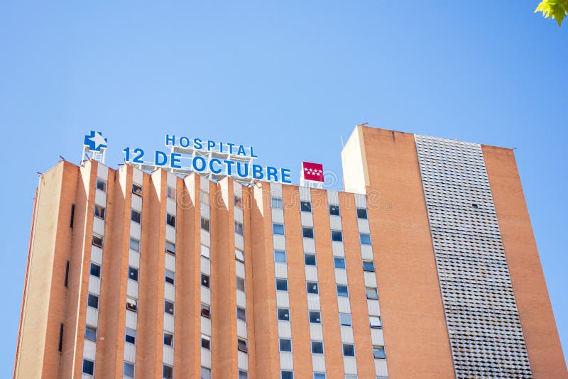 Madrid, Spain; 08/15/2020: Main facade of the `12 de Octubre` hospital, one of the hospitals that supports strong pressure due to those admitted by covid-19. Madrid, Spain; 08/15/2020: Main facade of the `12 de Octubre` hospital, one of the hospitals that supports strong pressure due to those admitted by covid-19