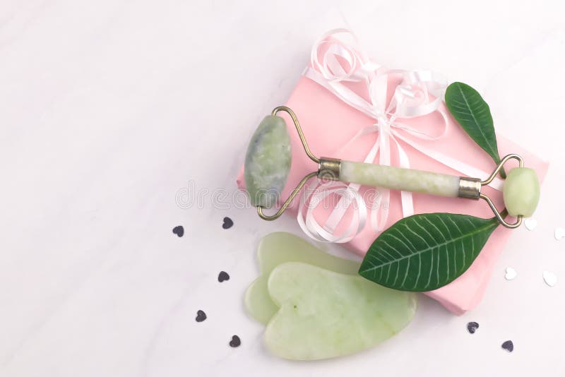 Facial and body stone massage instruments on light background stock images