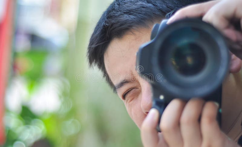 Facial closeup of male photographer taking photos stock photography Facial closeup of male photographer taking photos stock photography