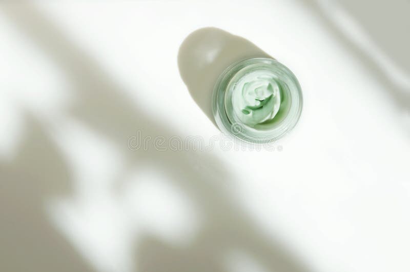 Facial cream on white background. Skin care concept. Natural hard light, deep shadows. stock images Facial cream on white background. Skin care concept. Natural hard light, deep shadows. stock images