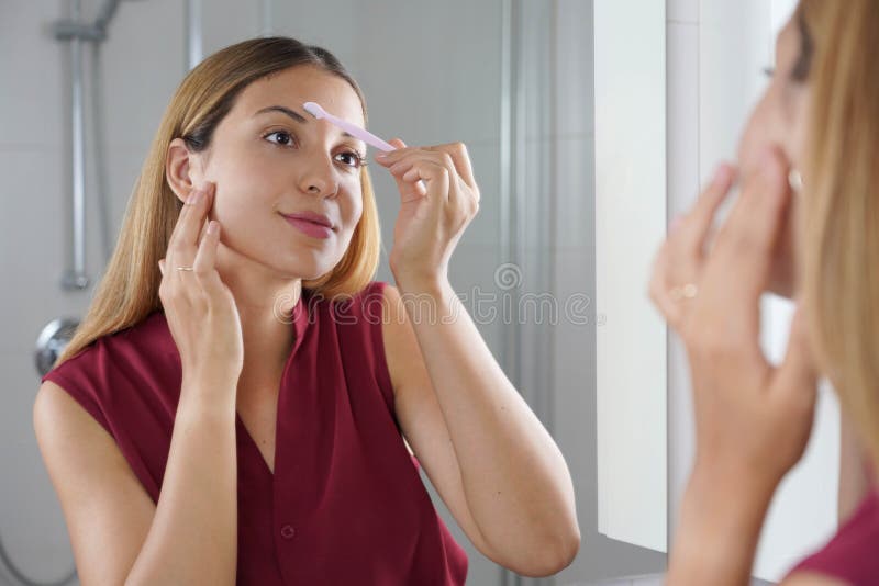 Facial Hair Removal. Beautiful Young Woman Shaving Her Face by Razor at Home  Stock Image - Image of coiffure, cosmetic: 253087031