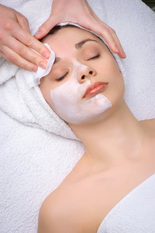 Facial mask removing at beauty salon