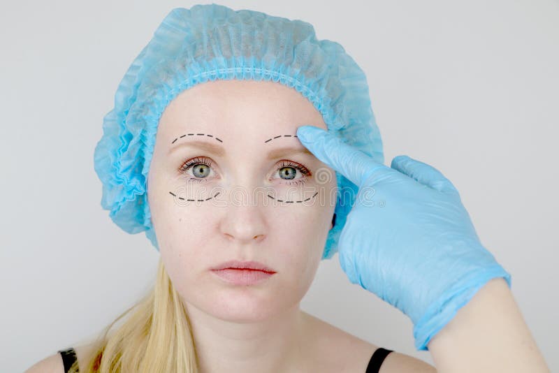 Man S Face with Correction Line Drawn by Person S Hand Stock Photo