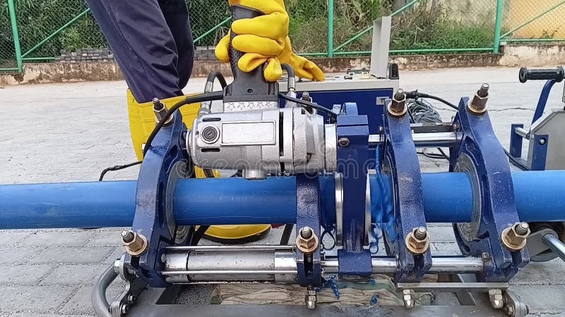 Facing and Trimming HDPE Pipe Ends using Butt Fusion Machine Cutter Tool stock footage