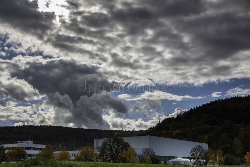 Factory in the middle of the colorful countryside royalty free stock photos