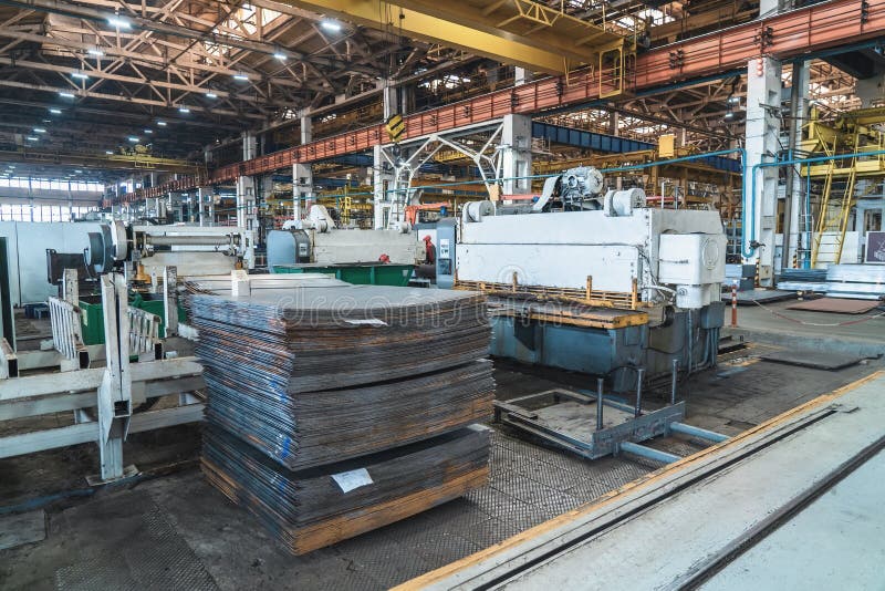 Factory for production of industrial equipment and machinery. Machine tools for working with iron and stack of metal royalty free stock image