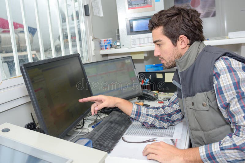 Factory software maintenance worker royalty free stock image Factory software maintenance worker royalty free stock image