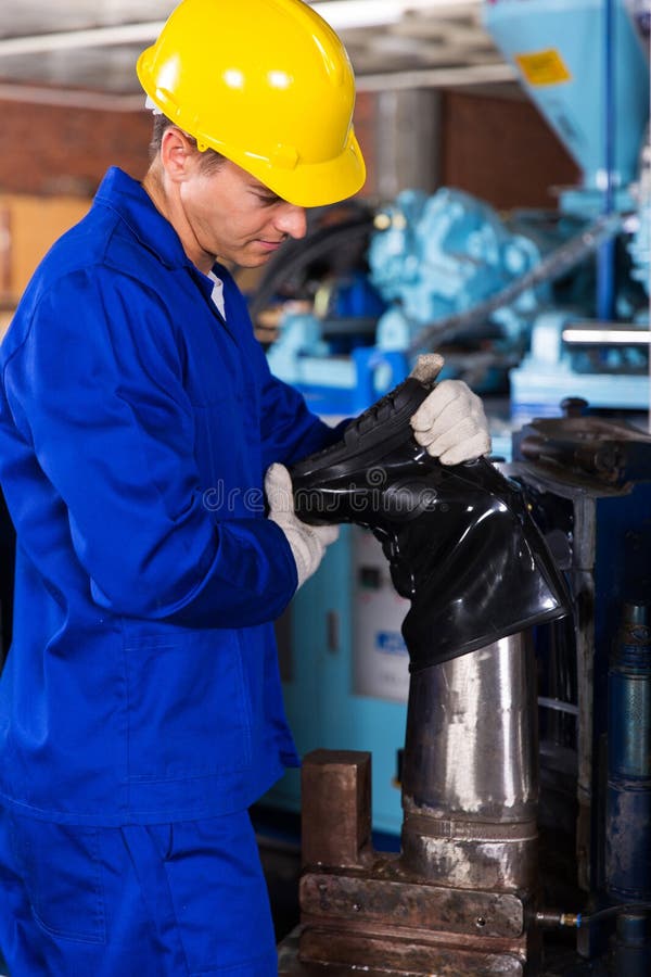 Young factory worker making gumboot. Young factory worker making gumboot