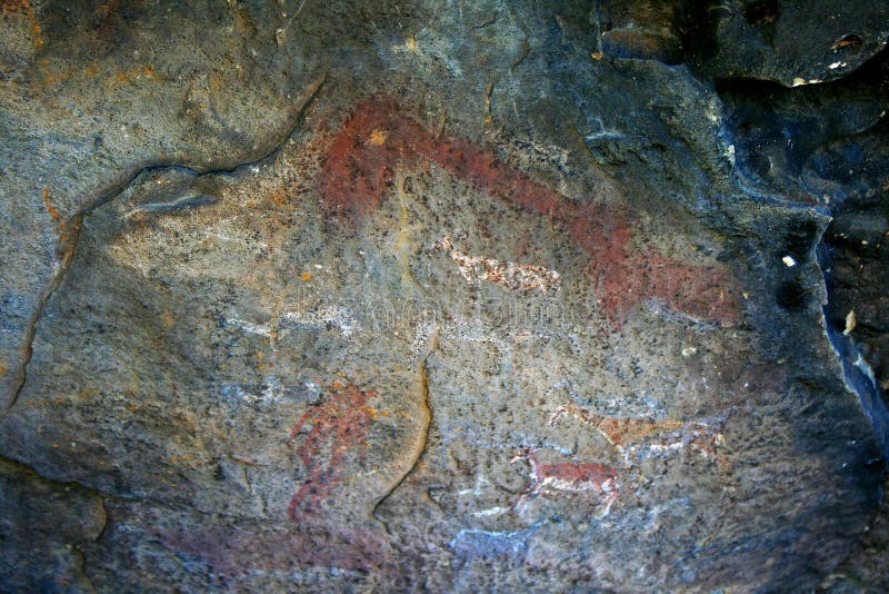 View of ancient bushman drawings on the interior wall of a rock cave. View of ancient bushman drawings on the interior wall of a rock cave.