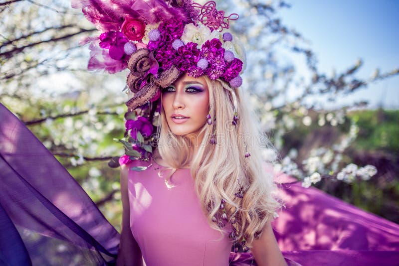 Fairies are real, beautiful Woman wearing a flower crown symbolizing spring - all images in this series shot with an open aperture - very shallow depth of field