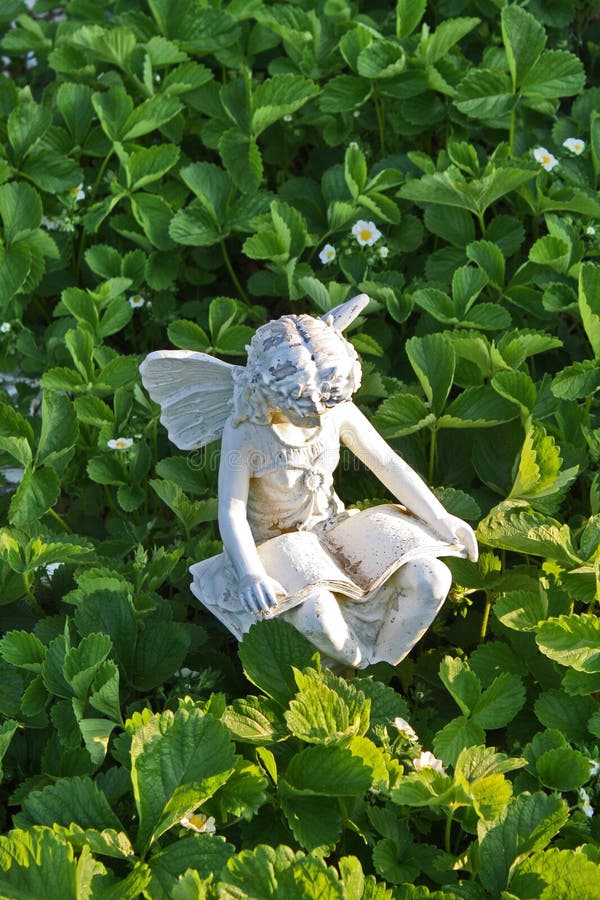 Fairy garden statue stock image. Image of read, flowers 15643961