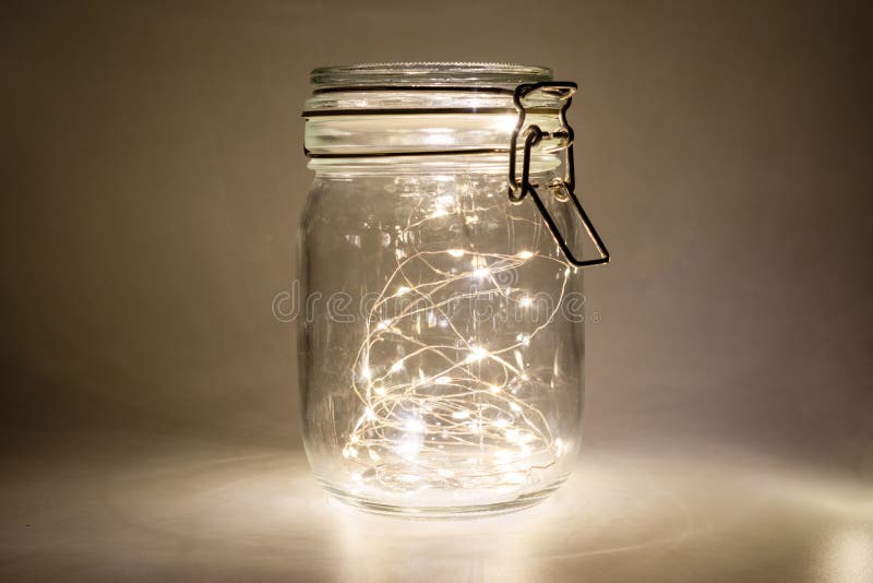 Fairy Lights in a Glass Jar, Isolated on a Dark Background Stock Photo