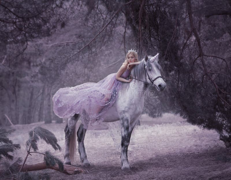 A fairy in a purple, transparent dress with a long flying train lies on a unicorn. Sleeping Beauty. Blonde girl walking with pegasus in the forest. The Elven Song. Artistic processing