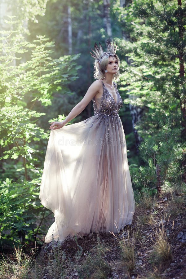 Fairytale Girl In Beautiful Stones. Stones In The Moss. Stock Photo ...