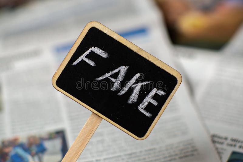Fake News. Sign with the Inscription Fake on the Background of ...