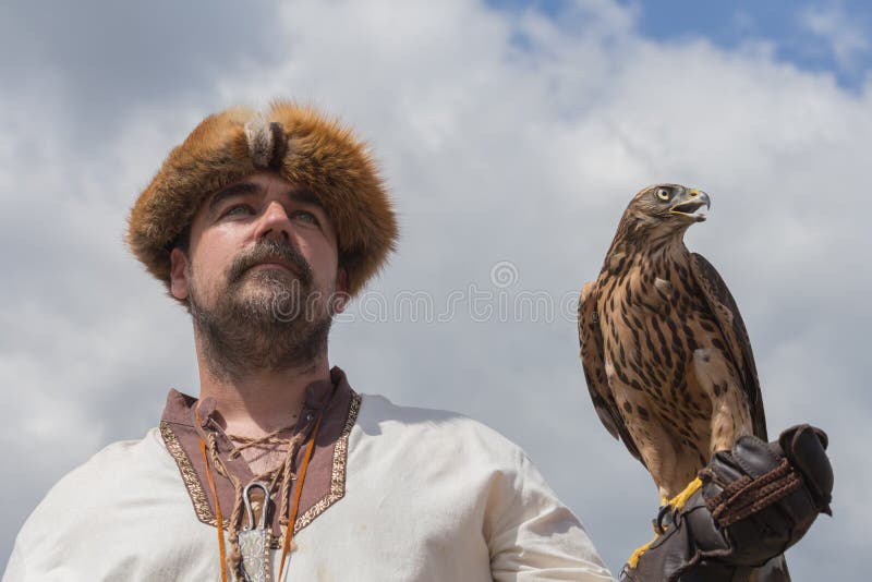 Falconer and the hawk editorial stock photo. Image of hawk 26004608