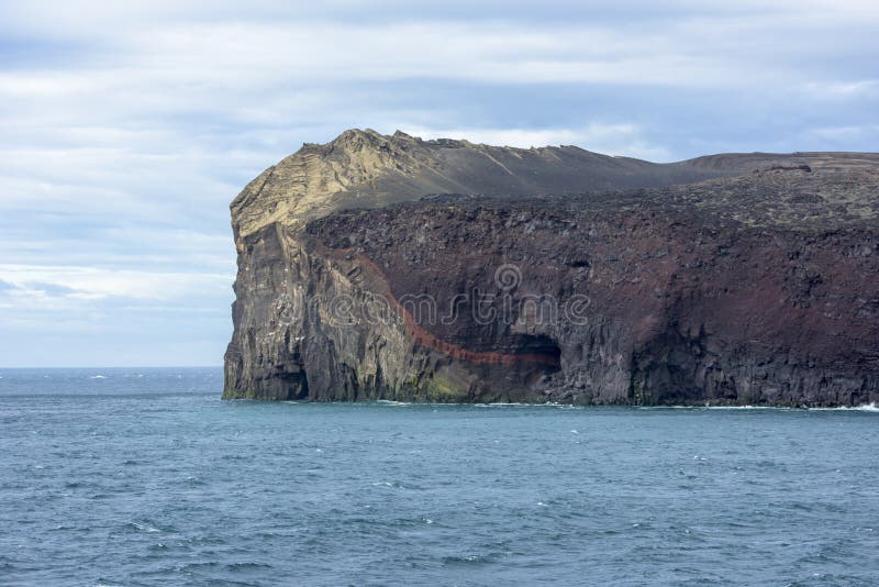 Cliffs of Surtsey, a new island in Atlantic Ocean formed by volcanic eruptions 1963 - 1967. UNESCO World Heritage site. Cliffs of Surtsey, a new island in Atlantic Ocean formed by volcanic eruptions 1963 - 1967. UNESCO World Heritage site.