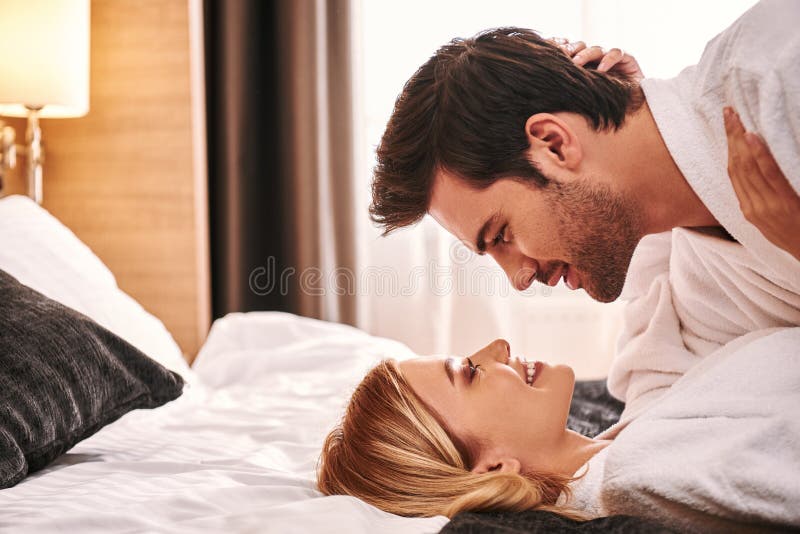 Fall In Love Young Couple Lying Together In Hotel Room Bed Stock Photo