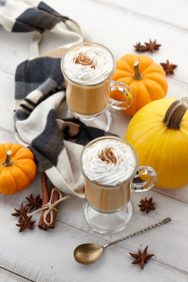 Fall Pumpkin Spice Latte With Whipped Cream On White Wooden Background