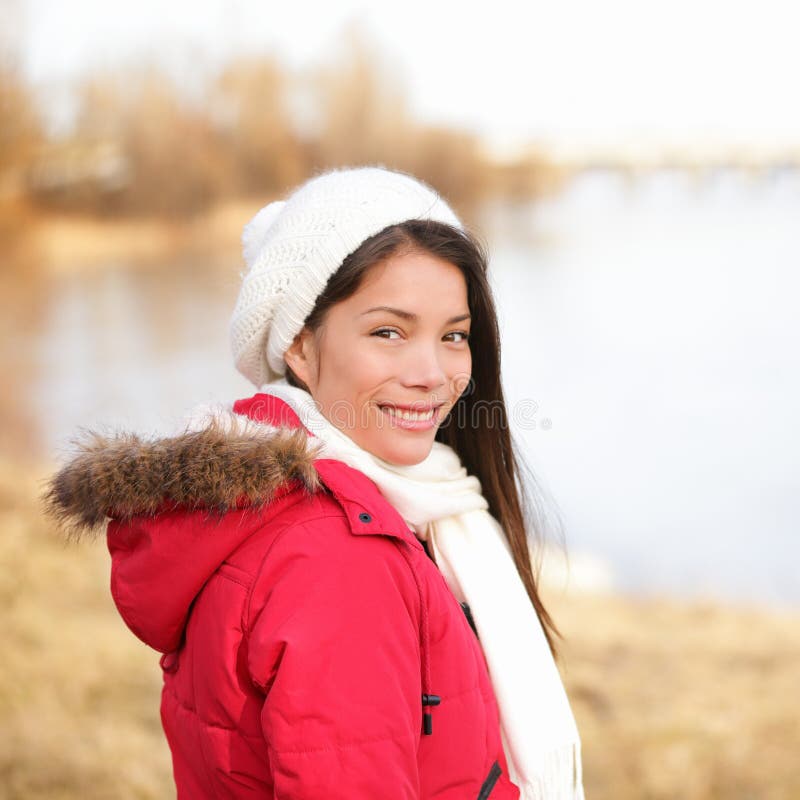 Fall woman enjoying late autumn / winter at lake